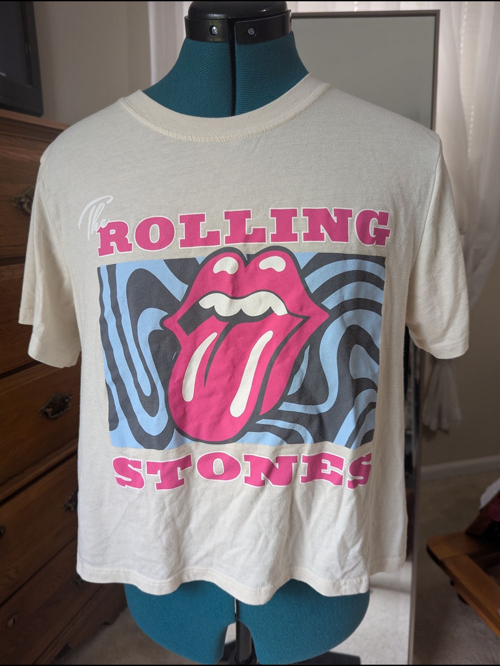 the Rolling Stones Cream Graphic Tee with Pink & Blue Logo